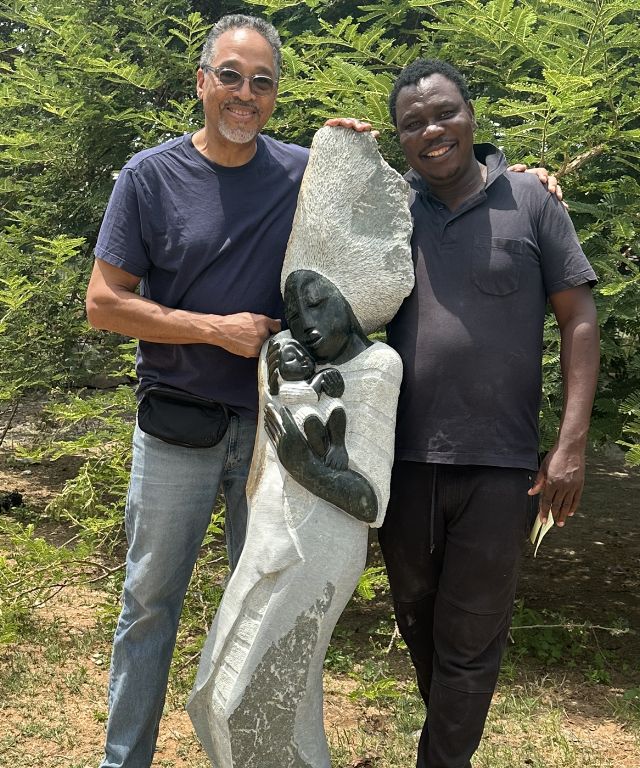 Wayne with sculptor Edious